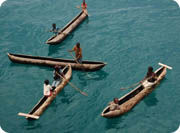 mountain bike - mission malawi - dugout canoes lake malawi